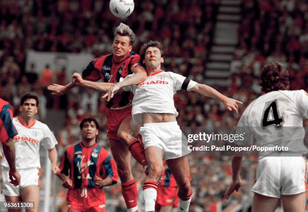 Alan Pardew of Crystal Palace and Bryan Robson of Manchester United battle for the ball during the FA Cup Final at Wembley Stadium on May 12, 1990 in...