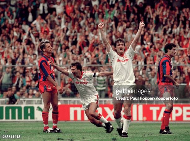 Bryan Robson of Manchester United celebrates after scoring alongside teammate Mark Hughes during the FA Cup Final between Crystal Palace and...