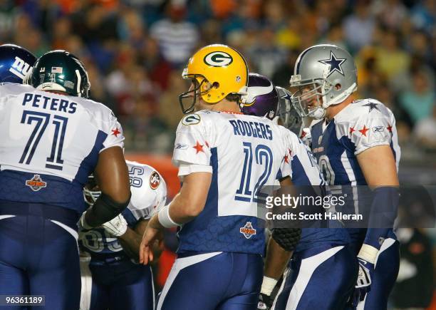 Aaron Rodgers of the NFC's Green Bay Packers stands in the huddle during the 2010 AFC-NFC Pro Bowl game at Sun Life Stadium on January 31, 2010 in...