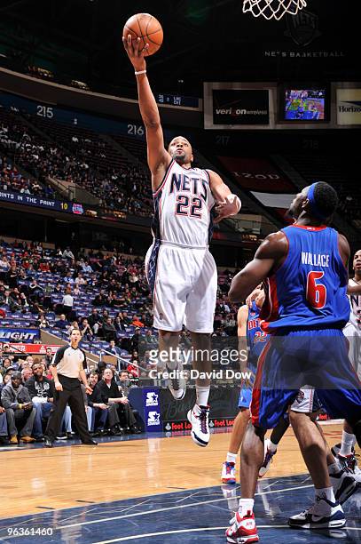 Jarvis Hayes of the New Jersey Nets shoots against Ben Wallace of the Detroit Pistons during the game on February 2, 2010 at the Izod Center in East...