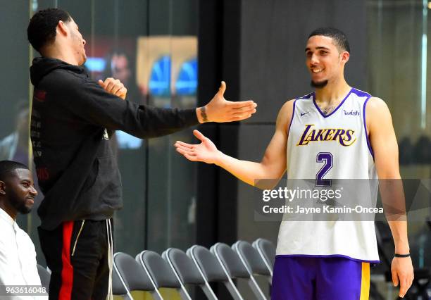 Agent Harrison Gaines looks on as Lonzo Ball of the Los Angeles Lakers greets his brother LiAngelo Ball after he completed his NBA Pre-Draft Workout...