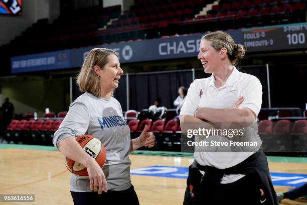 Cheryl Reeve of the Minnesota Lynx talks with Katie Smith of the New York Liberty before the game between the two teams on May 25, 2018 at...