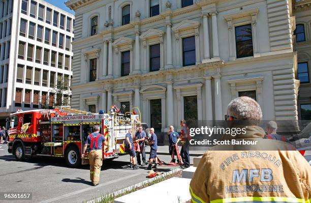 Victorian firefighters and emergency services work outside of the Victorian Premier's office after a suspect package containing an unidentified...