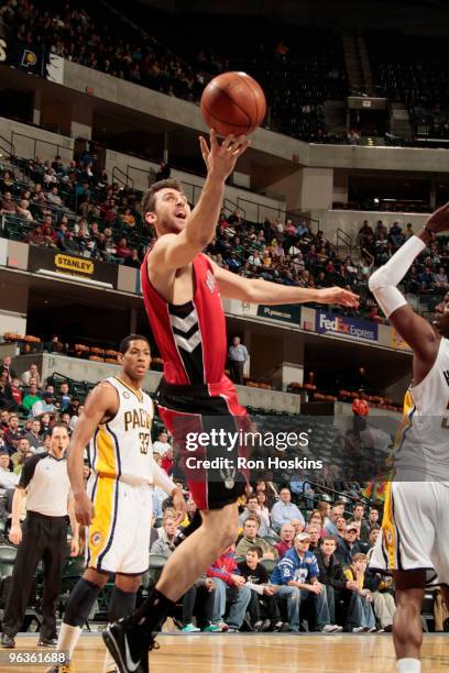 Andrea Bargnani of the Toronto Raptors lays the ball up on Danny Granger of the Indiana Pacers at Conseco Fieldhouse on February 2, 2010 in...