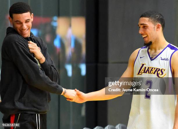 Lonzo Ball of the Los Angeles Lakers greets his brother LiAngelo Ball after he completed his NBA Pre-Draft Workout with the Los Angeles Lakers on May...