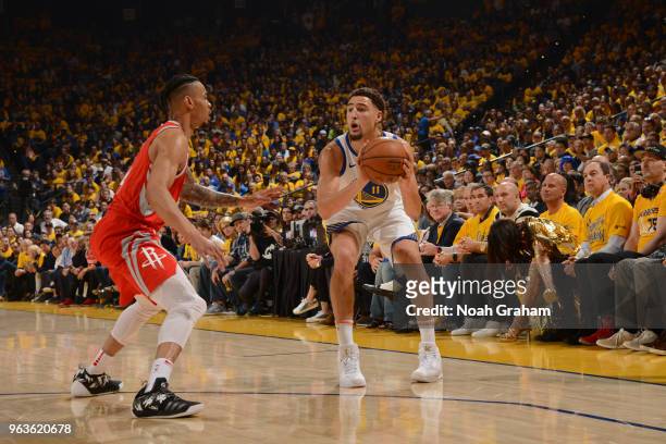 Klay Thompson of the Golden State Warriors shoots the ball against Gerald Green of the Houston Rockets during Game Six of the Western Conference...