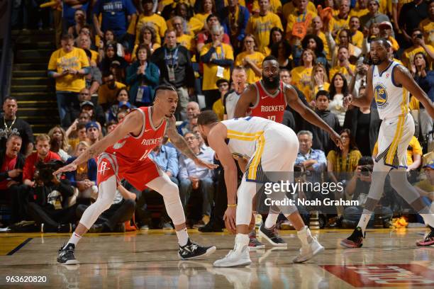 Stephen Curry of the Golden State Warriors handles the ball against Gerald Green of the Houston Rockets during Game Six of the Western Conference...