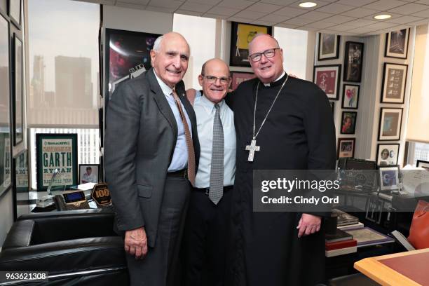 Businessman/ author Ken Langone, President/ Chief Content Officer of SiriusXM Radio, Scott Greenstein and Cardinal Timothy Dolan pose for a photo as...