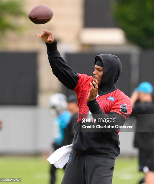 Carolina Panthers quarterback Cam Newton throws during organized team activities in Charlotte, N.C., on Tuesday, May 29, 2018.