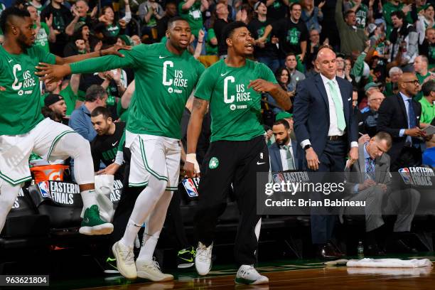 Guerschon Yabusele and Marcus Smart of the Boston Celtics react against the Cleveland Cavaliers during Game Seven of the Eastern Conference Finals of...