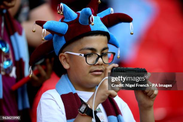 Young Aston Villa fan in the stands shows their support during the Sky Bet Championship Final at Wembley Stadium, London.
