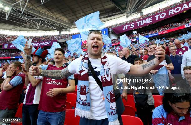 Aston Villa fans in the stands show their support during the Sky Bet Championship Final at Wembley Stadium, London.