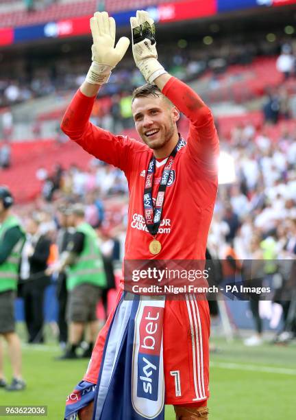 Fulham goalkeeper Marcus Bettinelli celebrates after the final whistle during the Sky Bet Championship Final at Wembley Stadium, London.
