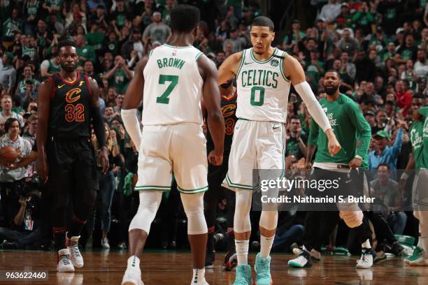 Jaylen Brown and Jayson Tatum of the Boston Celtics exchange a handshake during Game Seven of the Eastern Conference Finals of the 2018 NBA Playoffs...