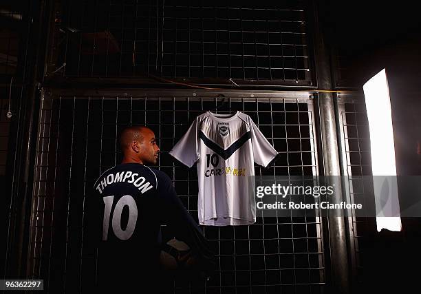 Archie Thompson of the Victory poses with the playing strip the Melbourne Victory will wear for the 2010 Asian Champions League at Etihad Stadium on...