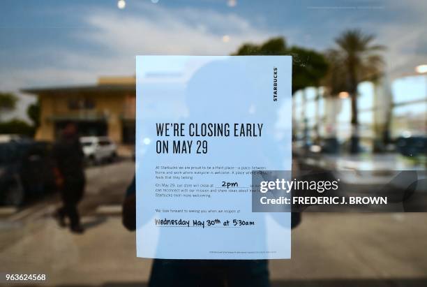 Sign is posted at the entrance to a Starbucks in Rosemead, California on May 29 advising customers of its closure for the day. - Starbucks closed...