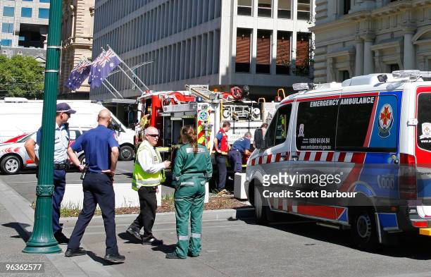 Victorian firefighters and emergency services work outside of the Victorian Premier's office after a suspect package containing an unidentified...