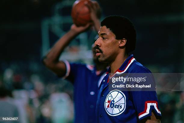 Julius Erving of the Philadelphia 76ers looks on against the Boston Celtics during a game played in 1981 at the Boston Garden in Boston,...