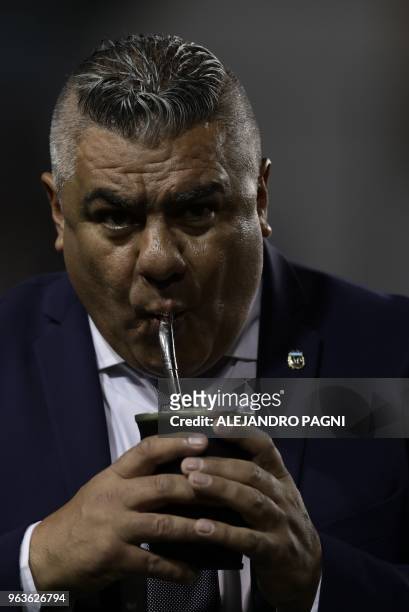 The president of the Argentine Football Association, Claudio Tapia, sips mate during the international friendly football match between Argentina and...