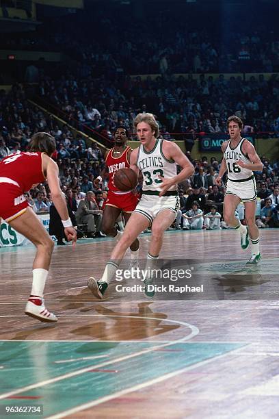 Larry Bird of the Boston Celtics stopps for a shot against the Houston Rockets during a game played in 1981 at the Boston Garden in Boston,...