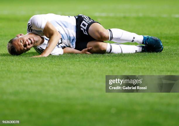 Giovani Lo Celso of Argentina reacts after receiving a foul from Ricardo Ade of Haiti during an international friendly match between Argentina and...