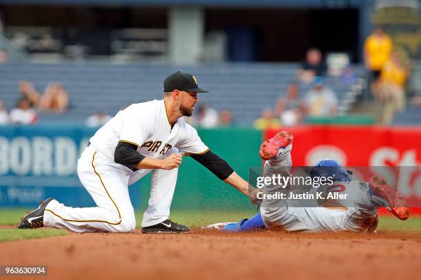 Jordy Mercer of the Pittsburgh Pirates catches Jason Heyward of the Chicago Cubs stealing in the first inning at PNC Park on May 29, 2018 in...