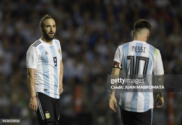 Argentina's forward Gonzalo Higuain chats with forward Lionel Messi during the international friendly football match against Haiti at Boca Juniors'...