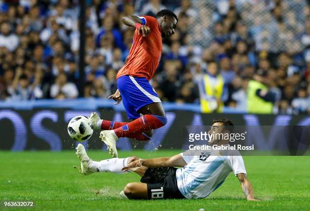 Eduardo Salvio of Argentina fights for the ball with Derrick Etienne of Haiti during an international friendly match between Argentina and Haiti at...