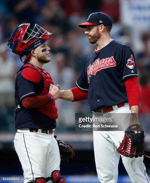 Roberto Perez and Zach McAllister of the Cleveland Indians celebrate a 7-3 victory over the Chicago White Sox at Progressive Field on May 29, 2018 in...