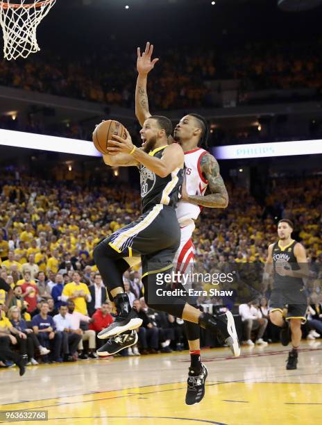 Stephen Curry of the Golden State Warriors goes up for a shot against Gerald Green of the Houston Rockets during Game 4 of the Western Conference...
