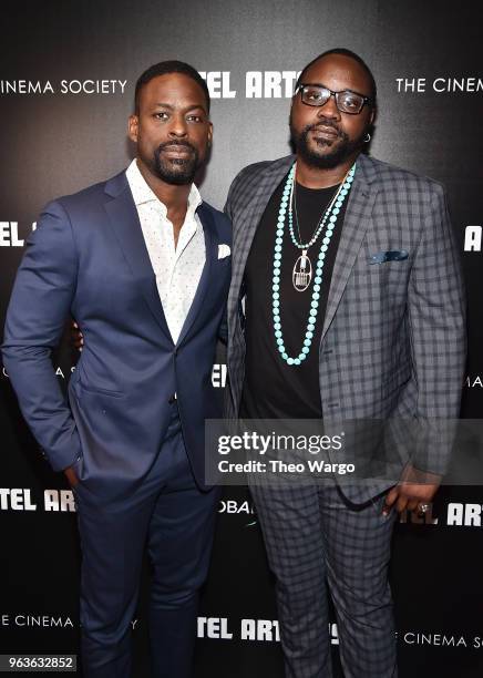 Sterling K. Brown and Brian Tyree Henry attend the screening of "Hotel Artemis" at Quad Cinema on May 29, 2018 in New York City.