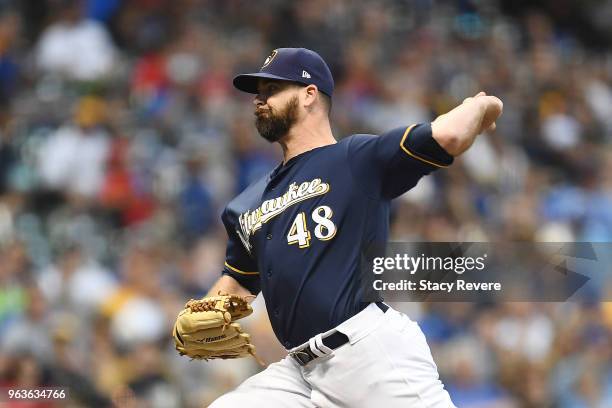 Boone Logan of the Milwaukee Brewers throws a pitch during the sixth inning of a game against the St. Louis Cardinals at Miller Park on May 29, 2018...