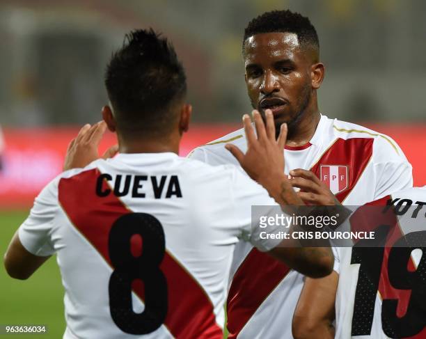 Peru's Christian Cueva celebrates with Jefferson Farfan after scoring against Scotland during a friendly match at the National Stadium in Lima on May...