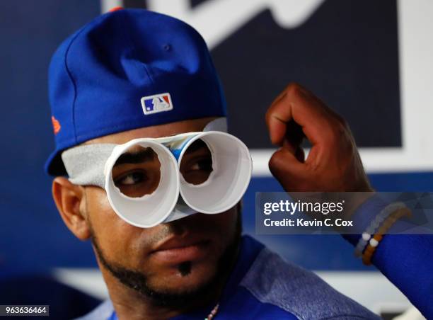 Yoenis Cespedes of the New York Mets jokes around in the dugout during the third inning against the Atlanta Braves at SunTrust Park on May 29, 2018...
