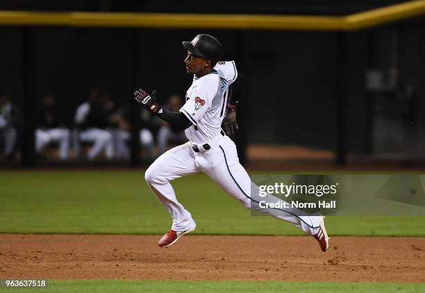 Jarrod Dyson of the Arizona Diamondbacks rounds second base on a hit by Ketel Marte during the third inning against the Cincinnati Reds at Chase...