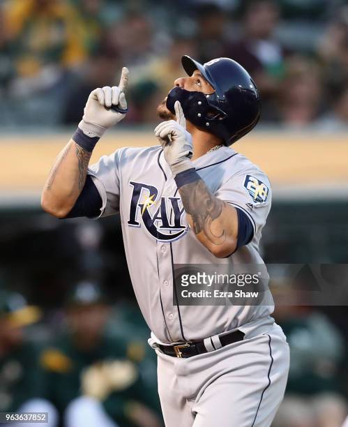 Wilson Ramos of the Tampa Bay Rays points to the sky after he hit a home run off of Daniel Gossett of the Oakland Athletics in the third inning at...