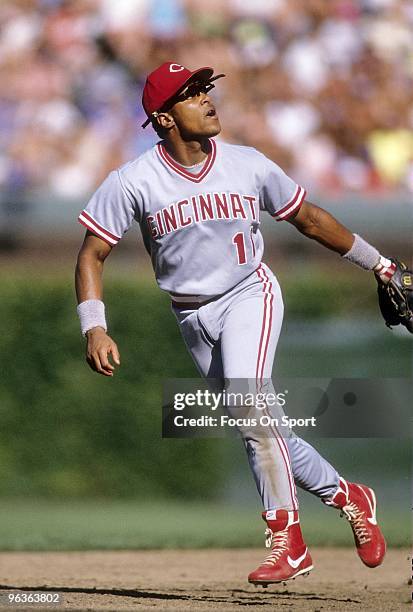S: Shortstop Barry Larkin of the Cincinnati Reds in action against the Chicago Cubs goes back on a pop-up during a circa early 1990's MLB baseball...