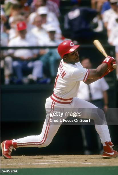 S: Shortstop Barry Larkin of the Cincinnati Reds in action swings at a pitch during a MLB baseball game circa 1990's at Riverfront Stadium in...