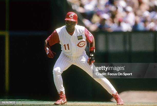 Shortstop Barry Larkin of the Cincinnati Reds in action leads off of first base during a MLB baseball game circa 1994 at Riverfront Stadium in...