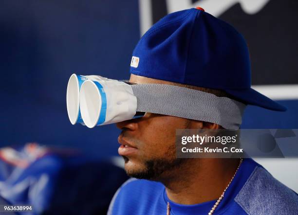 Yoenis Cespedes of the New York Mets jokes around in the dugout during the third inning against the Atlanta Braves at SunTrust Park on May 29, 2018...