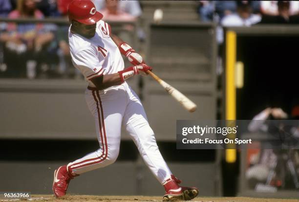 S: Shortstop Barry Larkin of the Cincinnati Reds swings and fouls the pitch off of his bat during a MLB baseball game circa 1990's at Riverfront...