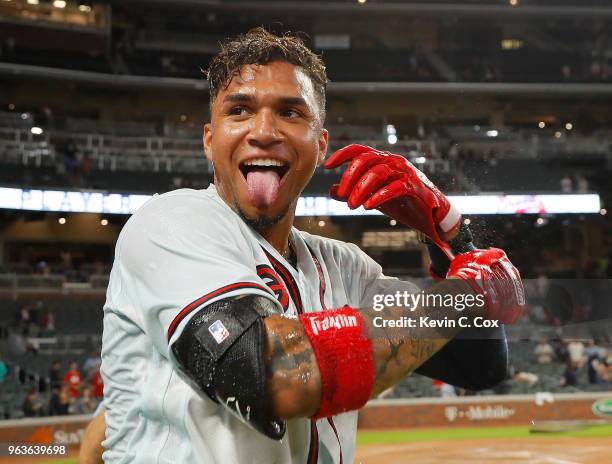 Johan Camargo of the Atlanta Braves reacts after being doused after his walk-off homer in the ninth inning of a 7-6 win over the New York Mets at...