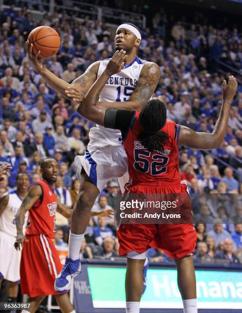 DeMarcus Cousins of the Kentucky Wildcats shoots the ball while defended by DeAundre Cranston of the Ole Miss Rebels during the SEC game on February...