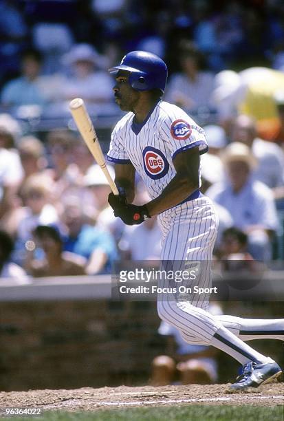 S: Outfielder Andre Dawson of the Chicago Cubs swings and watches the flight of his ball during a late circa 1980's Major League Baseball game at...
