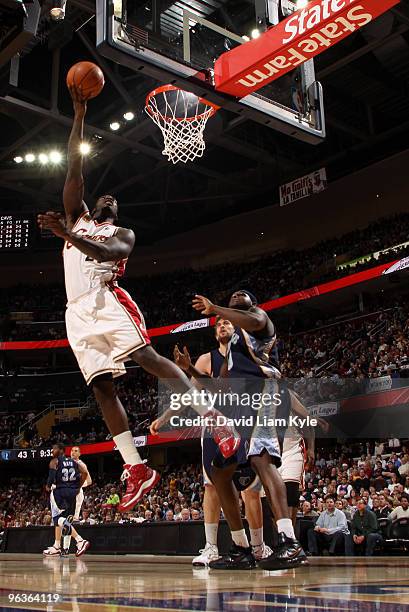 Hickson of the Cleveland Cavaliers puts up the shot against Jamaal Tinsley of the Memphis Grizzlies on February 2, 2010 at The Quicken Loans Arena in...