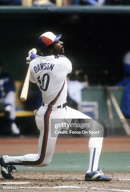 S: Outfielder Andre Dawson of the Montreal Expos swings and watches the flight of his ball during a mid circa 1980's Major League Baseball game at...