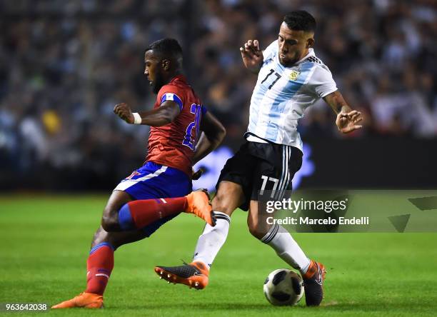 Nicolas Otamendi of Argentina fights for the ball with Duckens Nazon of Haiti during an international friendly match between Argentina and Haiti at...