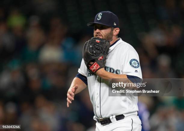 Relief pitcher Ryan Cook of the Seattle Mariners reacts after the final out of the top sixth inning a game against the Texas Rangers at Safeco Field...