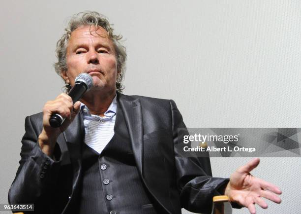 Actor John Savage answers questions during the Q & A portion of the 40th Anniversary Screening Of "The Deer Hunter" held at Ahrya Fine Arts Movie...