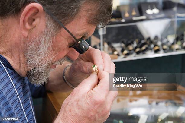 the appraiser - fine jewelry stock pictures, royalty-free photos & images
